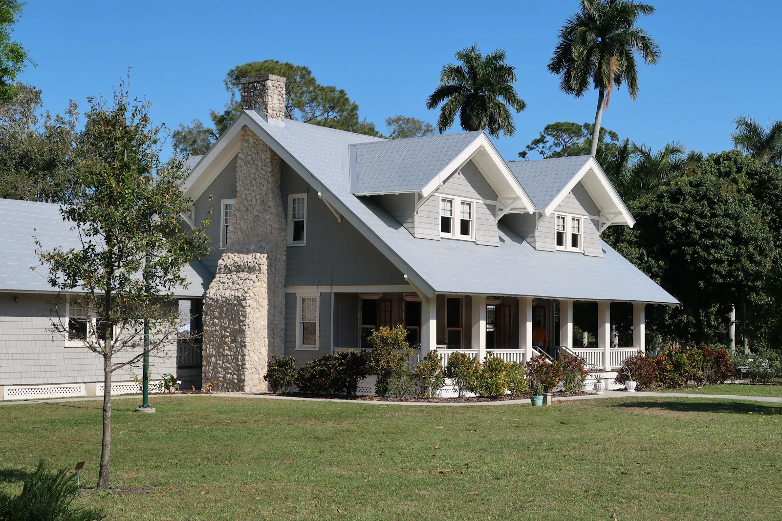 A 1950s concrete block ranch home in Azalea Park, FL with a foundation repair crew on site